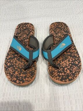 The North Face Kids Teal Strap Brown Patterned Flip Flops